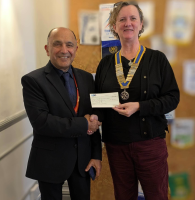 Donation presented to Hoss Atri by club President Lois Sparkes.